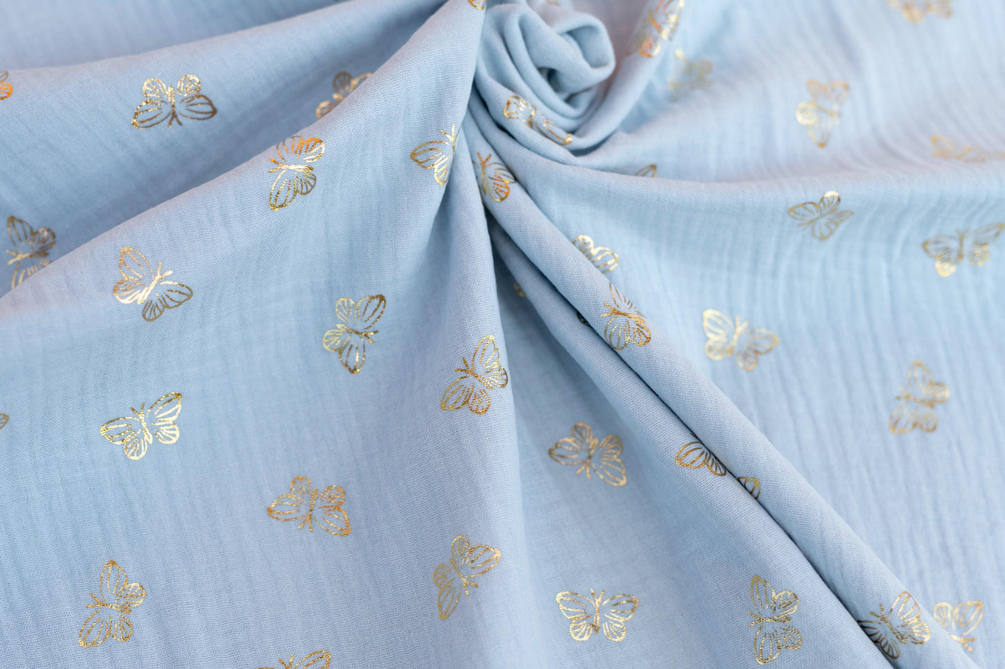 Musselin Stoff Schmetterling gold - hellblau